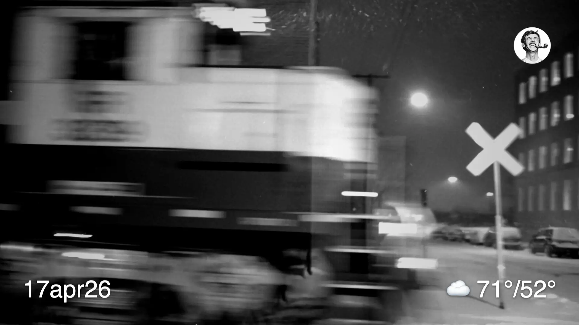 Blurry black and white film photo of a train passing