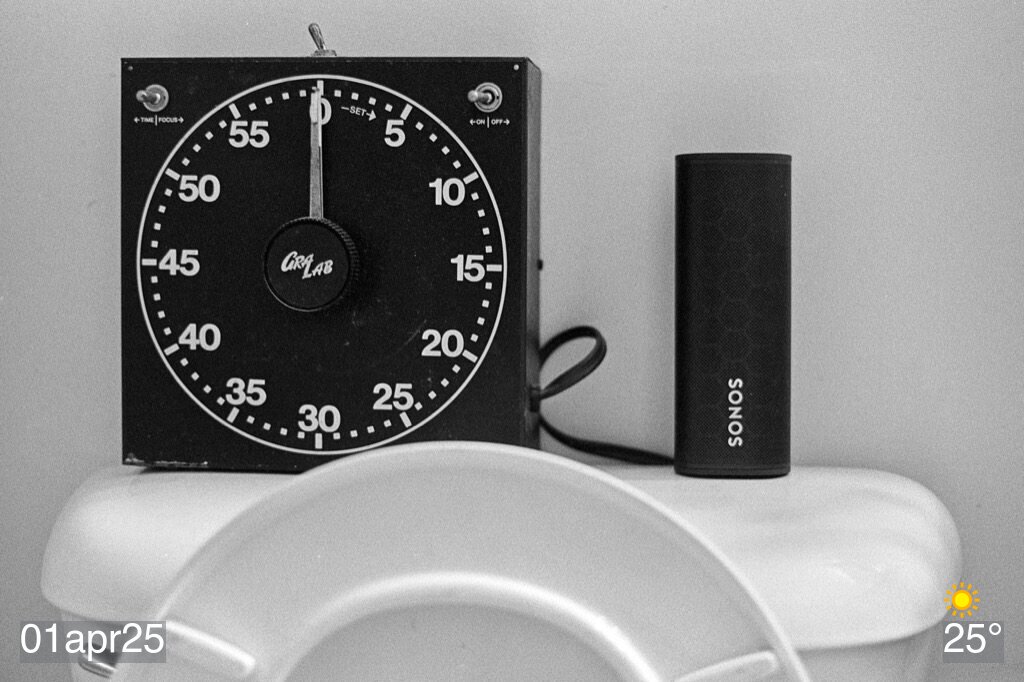 Gralab darkroom timer and Sonos roam on back of toilet